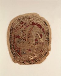 Textiles Medaillon mit stilisiertem Löwe