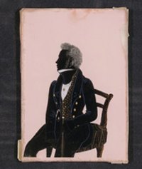 Hinterglassilhouette eines sitzenden Mannes