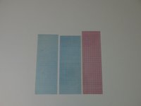 Drei Streifen Millimeterpapier